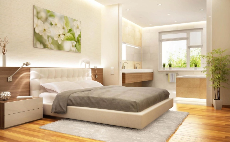Modernes Schlafzimmer mit Bett, großen Fenstern und offenem Badbereich